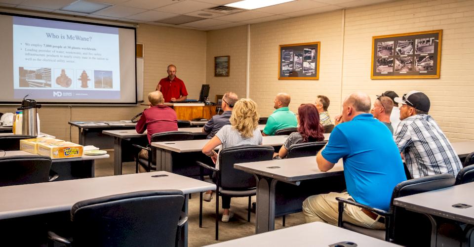 Aaron Loosli teaches a class.