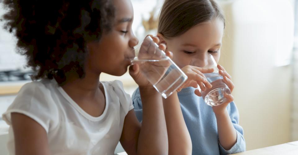 Enjoying a glass of clean, safe drinking water. Photo source: iStock