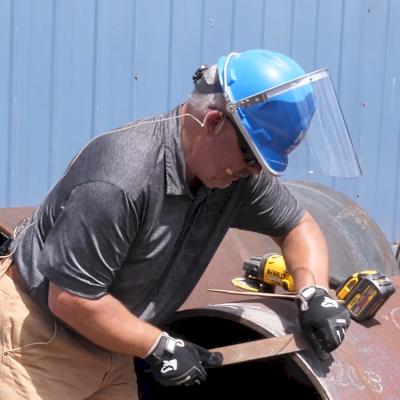 Use a file to create a chamfer to remove sharp edges.