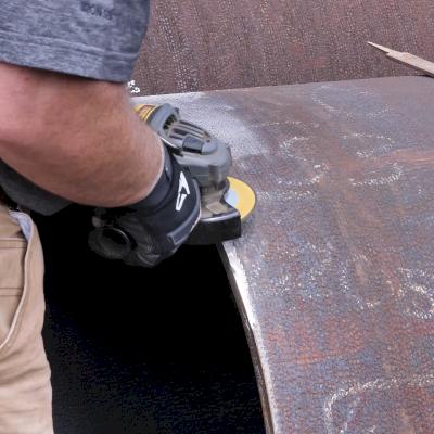 Use a grinder to create a beveled slope.