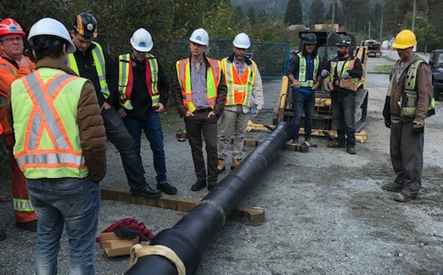 Engineers inspect a TR Flex pipeline.
