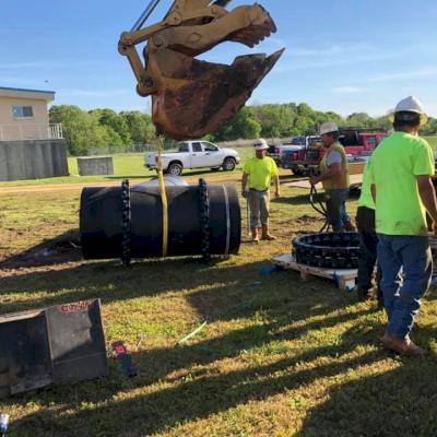 Lifting the pipe in place.