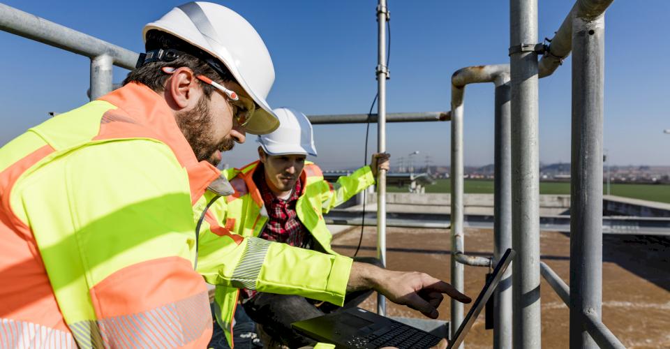Engineers at water treatment plant. Photo source. iStock