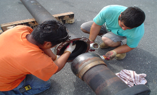 Applying lube to the pipe.