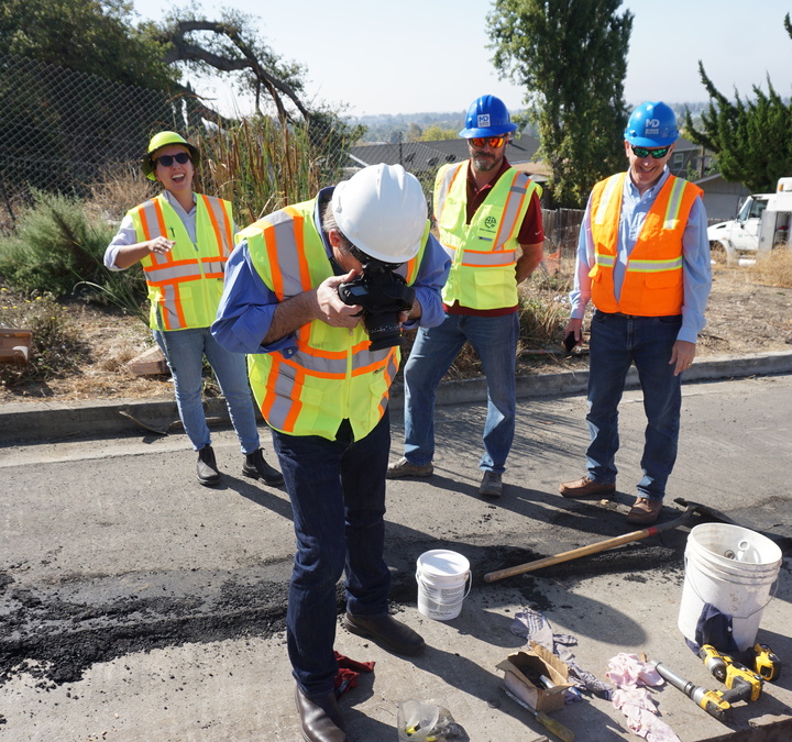 Taking a photo of the fault.